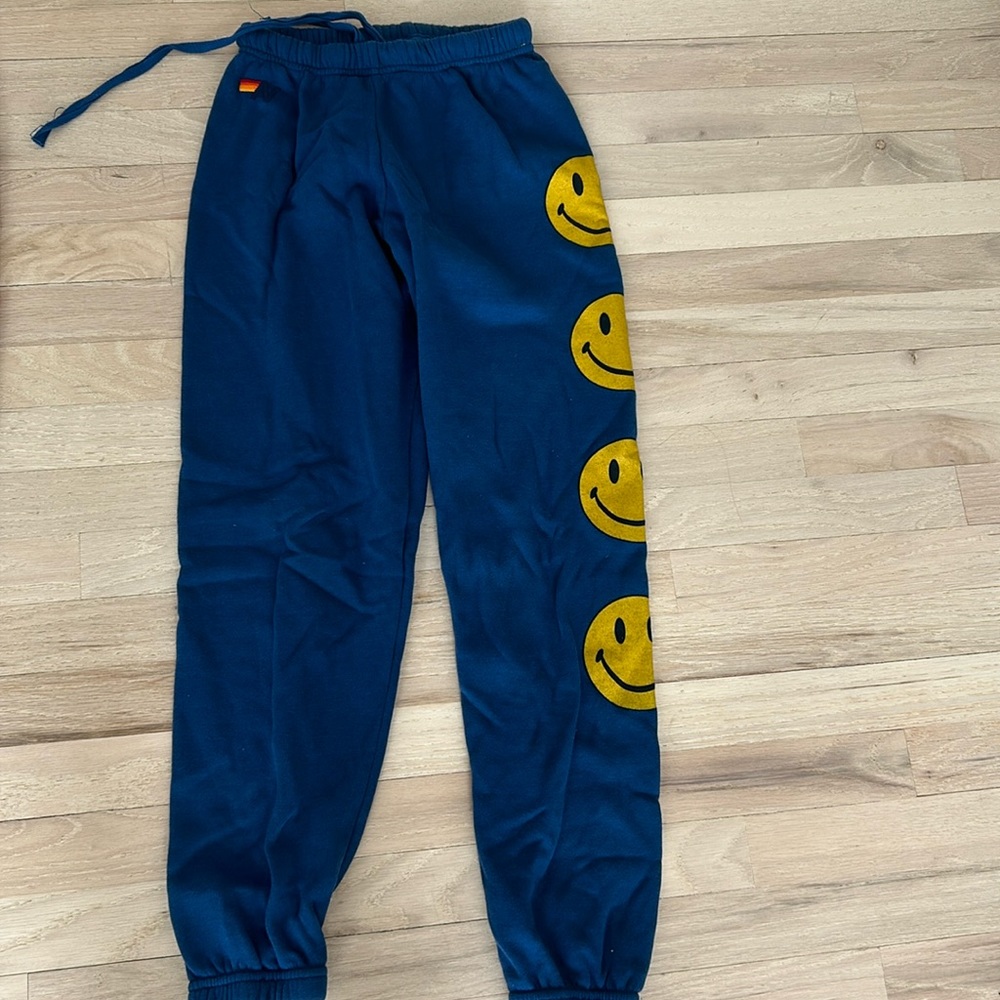 Blue smily face aviator sweatpants